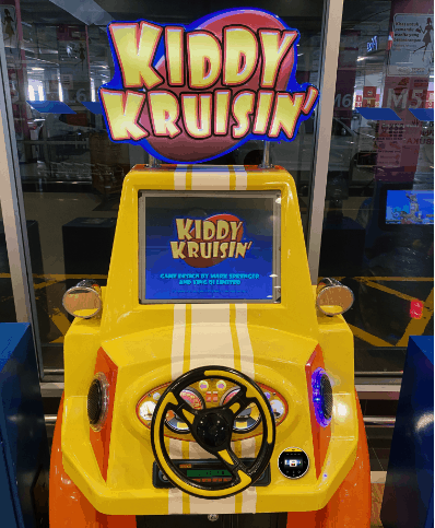A close-up of an RFID card reader on an arcade machine